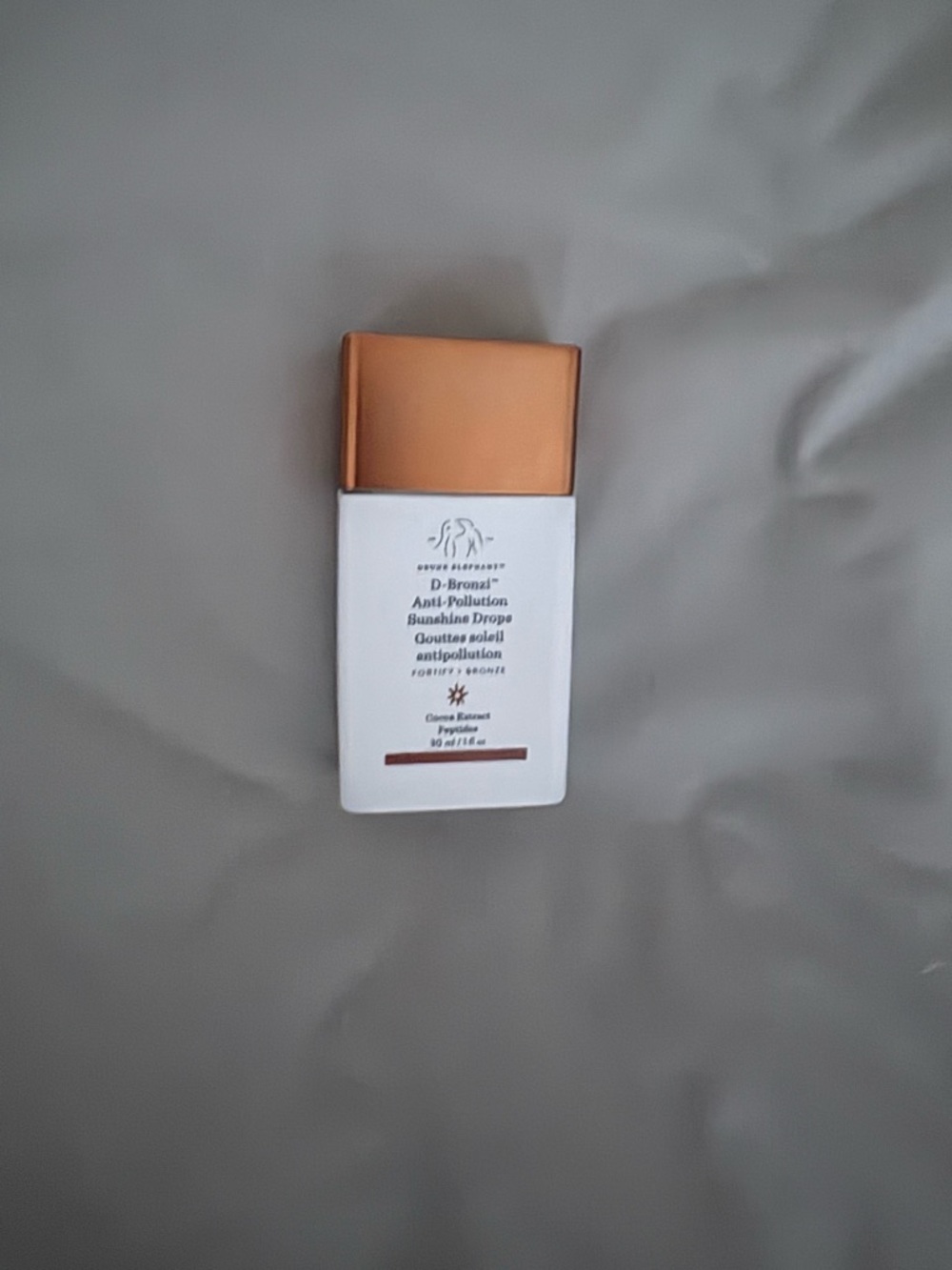 Drunk Elephant White & Gold Serum Bottle